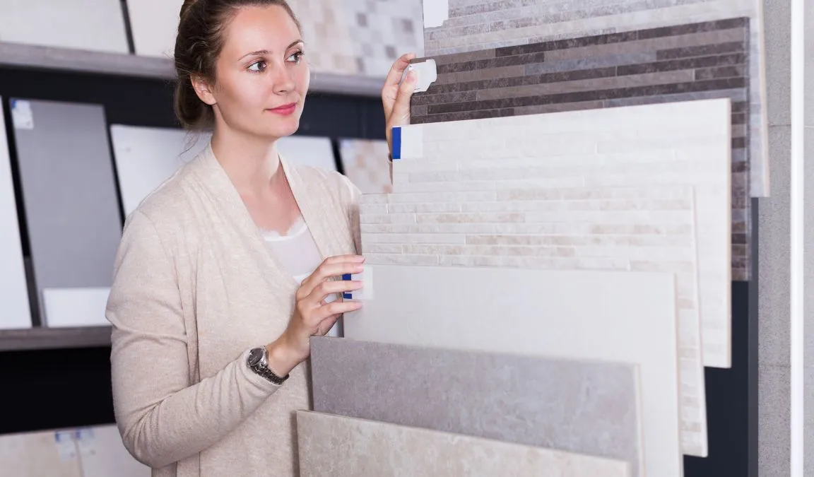 A women choosing tiles