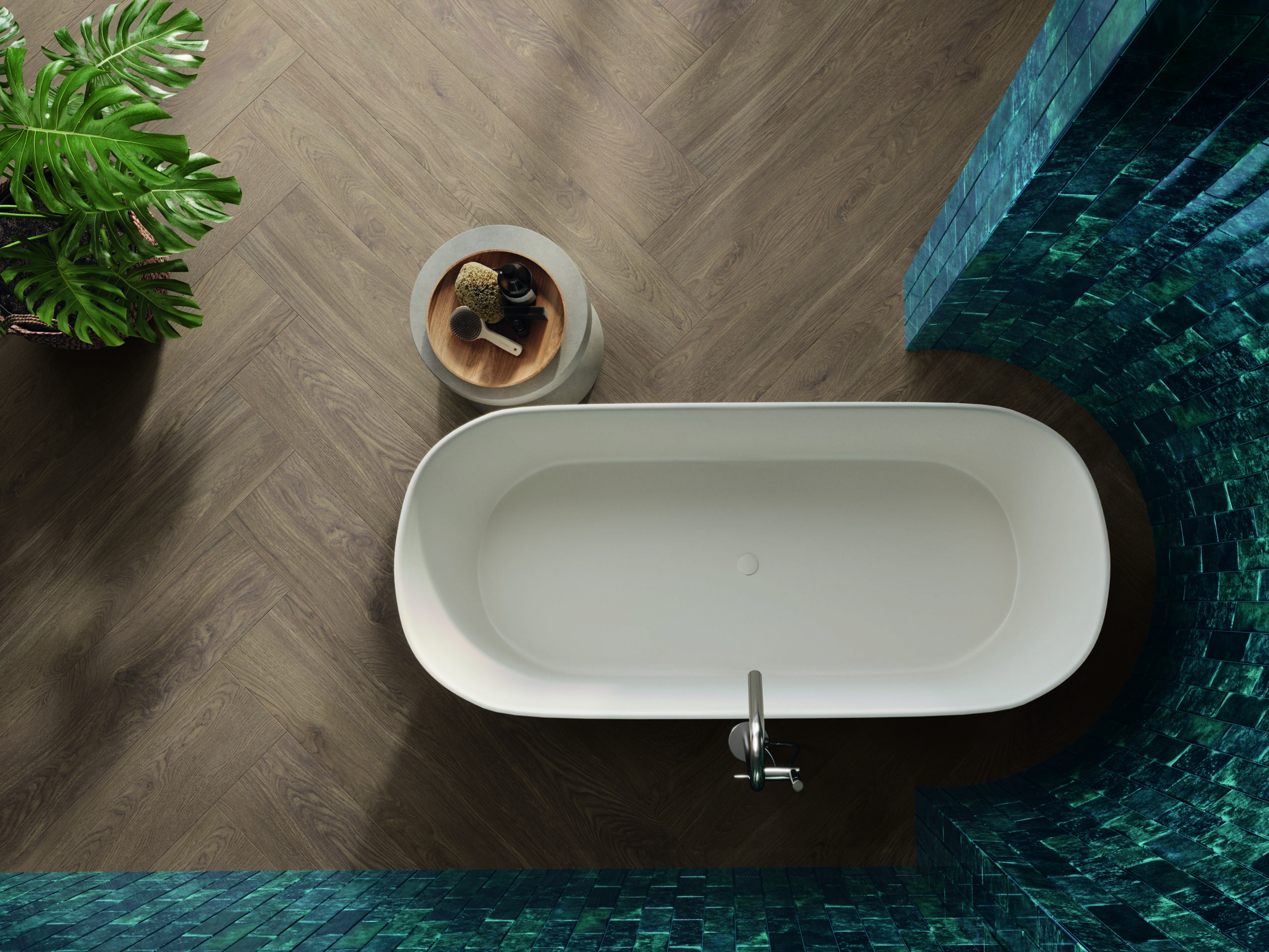 Luxurious bathroom with a freestanding white bathtub, wood-look porcelain floor tiles in a herringbone pattern, and vibrant blue mosaic wall tiles.
