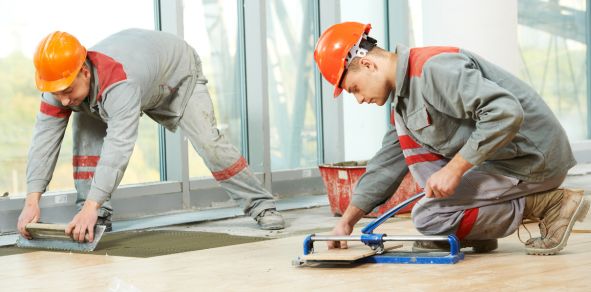 Professional Tiler Laying Tiles