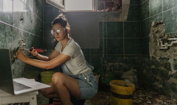Women Tiling Bathroom